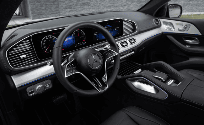 A Mercedes-Benz GLE with a luxurious interior design, steering wheel, and dashboard.