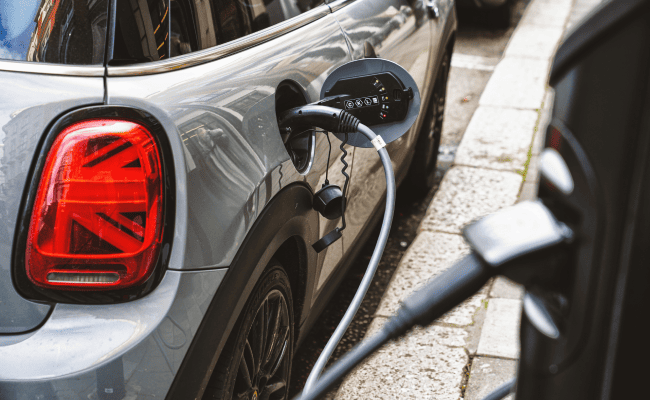 An EV MINI Cooper charging.